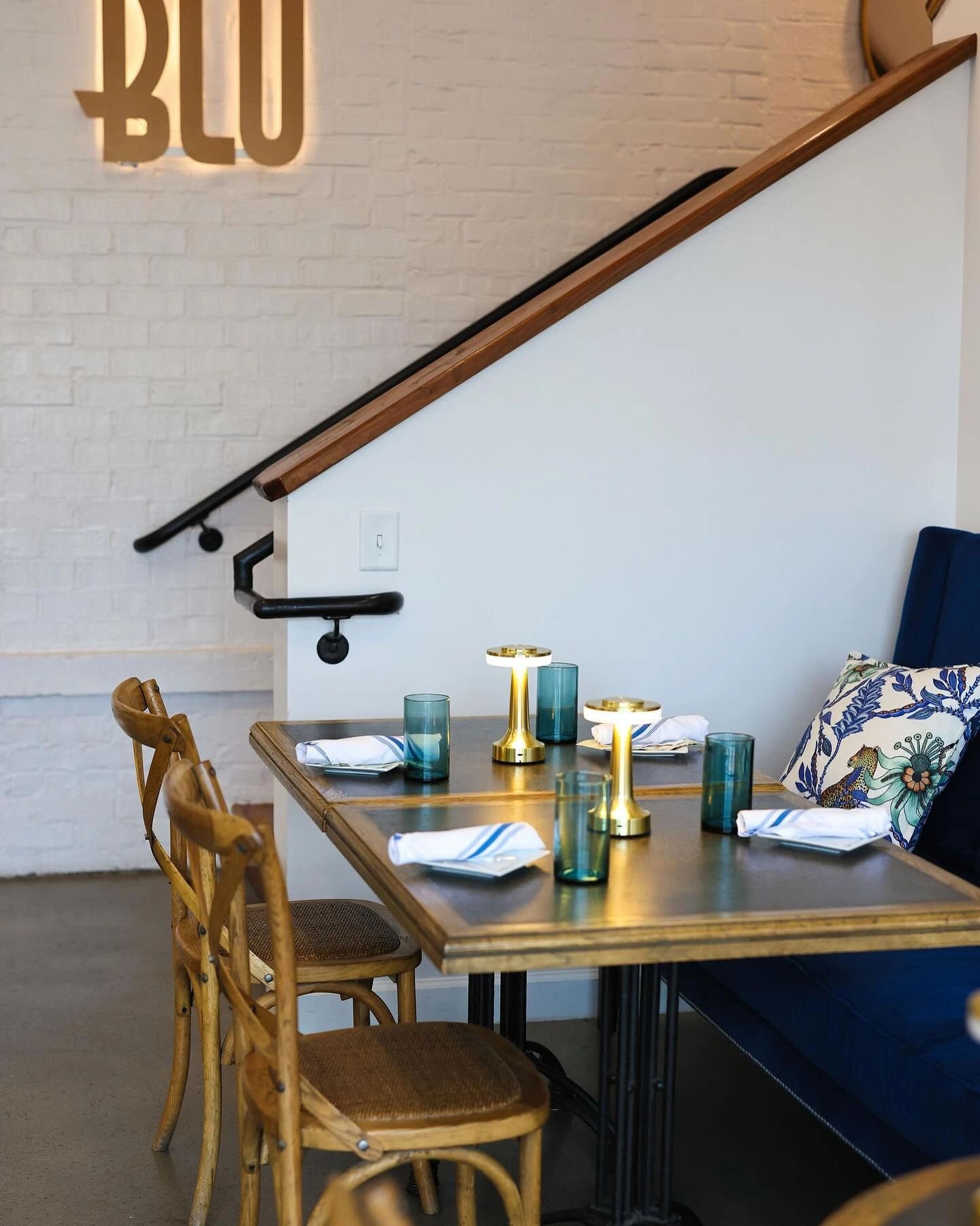 Dining room with wooden staircase