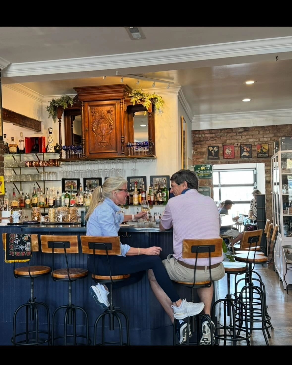 Patrons at vintage bar counter